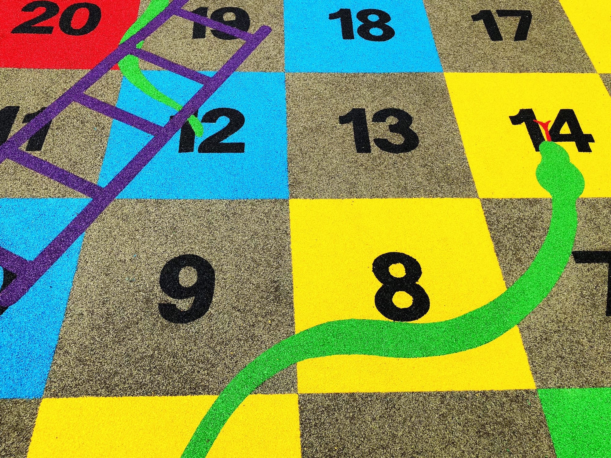 Playground markings of a snakes and ladders game