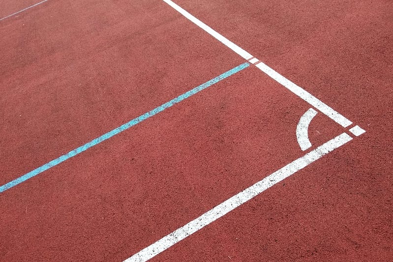Close-up of white marking lines of outdoor basketball court